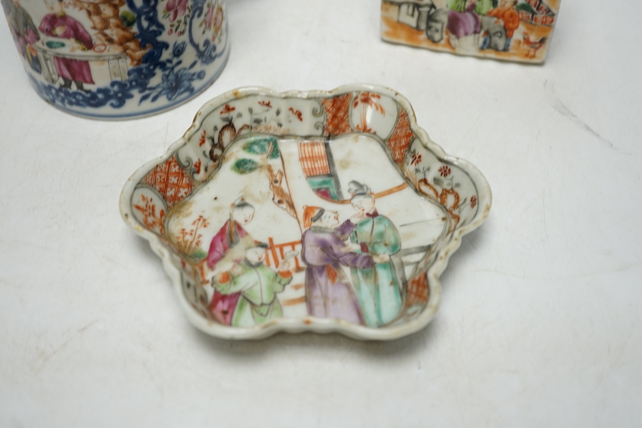 An 18th century Chinese export famille rose teapot stand, a mug and a tea canister, tallest 12cm. Condition - poor to fair